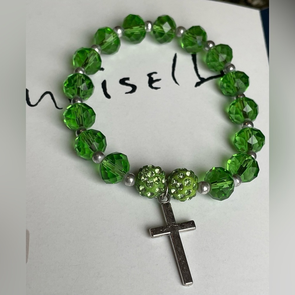 Green beaded stretchy bracelet with cross charm